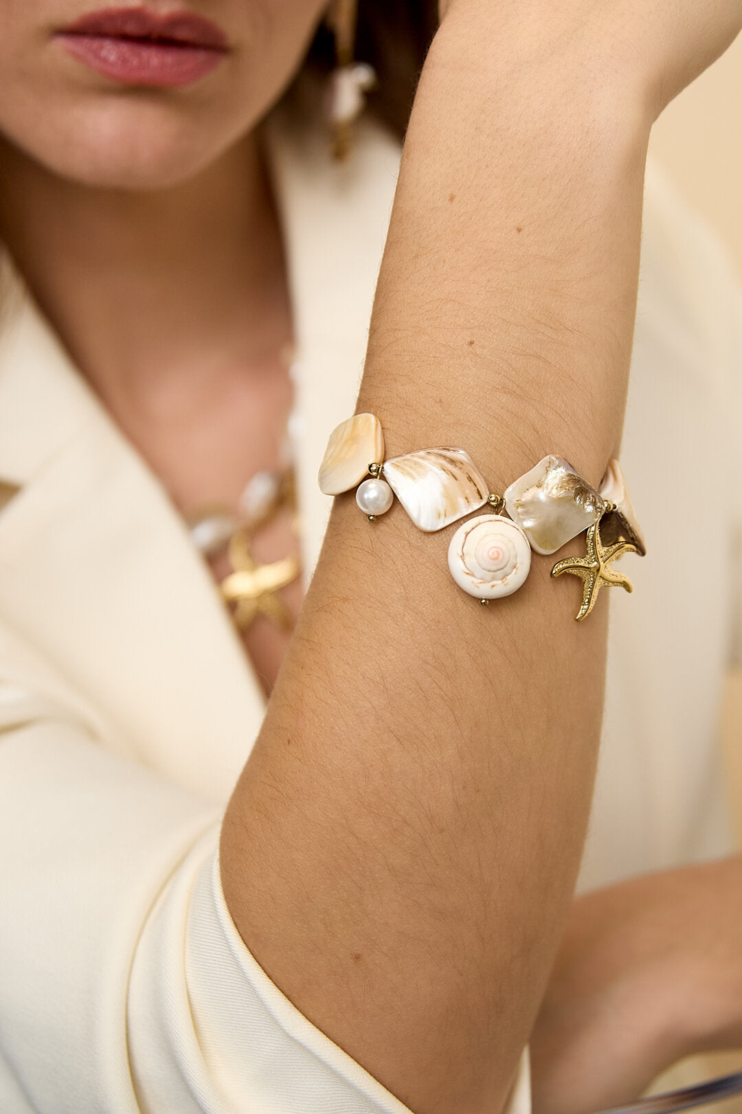 Bracelet with shells, sea charms and gold beads