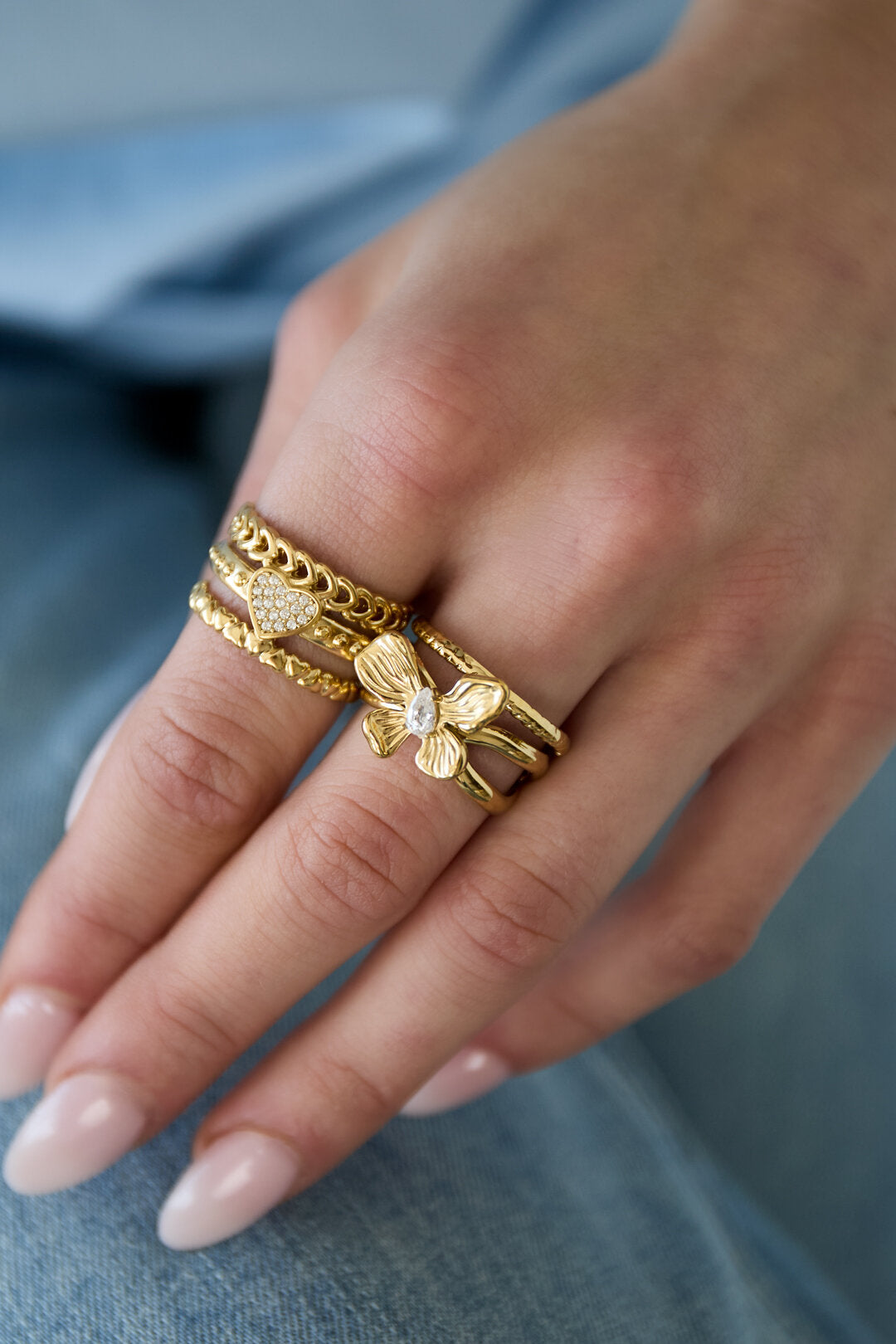 Layered statement ring with flower and stone