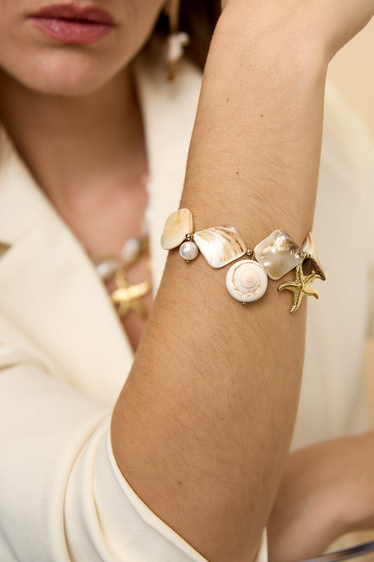 Bracelet with shells, sea charms and gold beads
