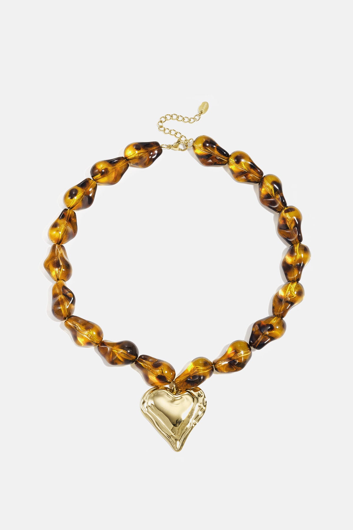 Beaded necklace with naturally shaped beads and a hanging heart